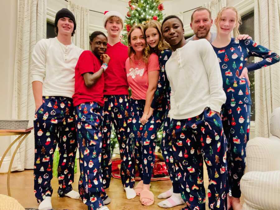 family together wearing matching Christmas pajamas