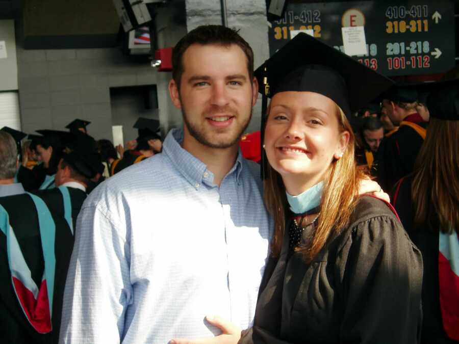 couple together at girlfriend's grad school graduation