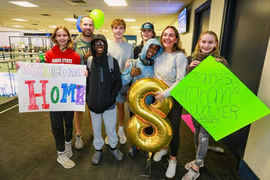 family welcomes home brothers they adopted from orphanage