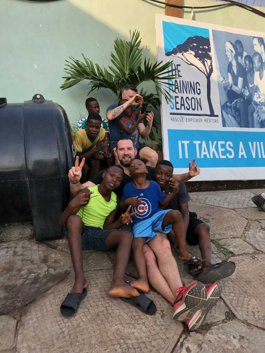 man with orphans in Africa