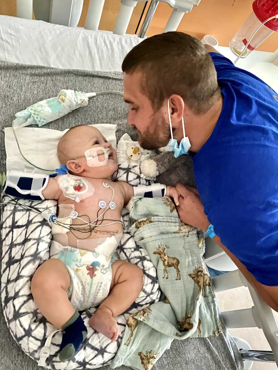 NICU baby smiles at his dad 