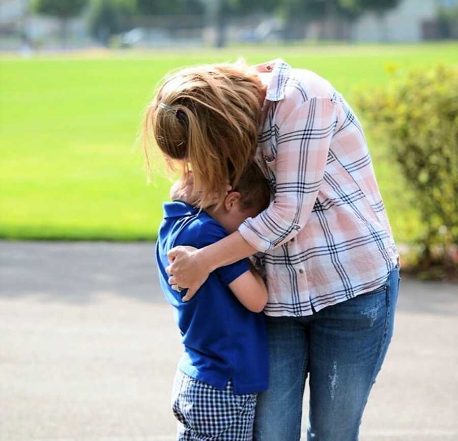 mom hugging her medically complex son 