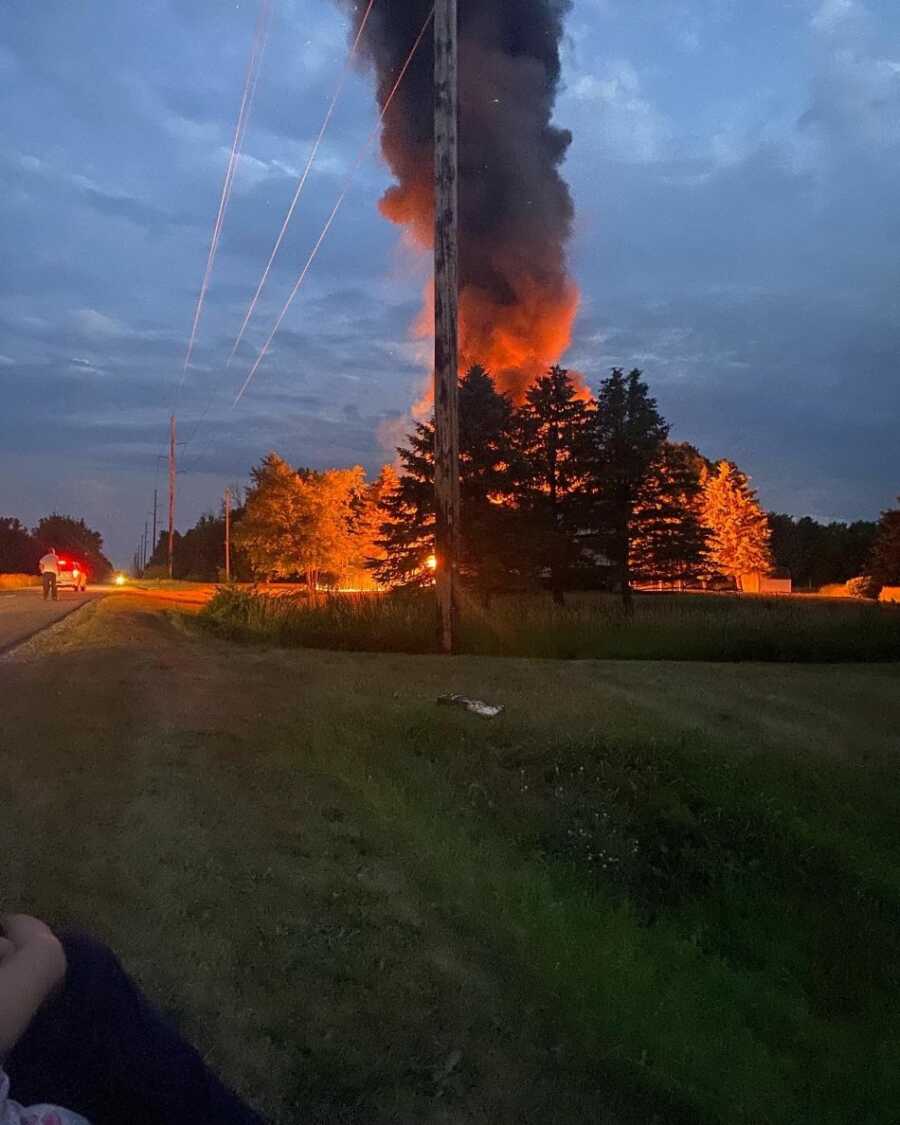 house up in flames with tons of smoke 