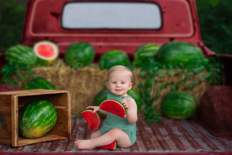 miracle baby boy with watermelon in truck