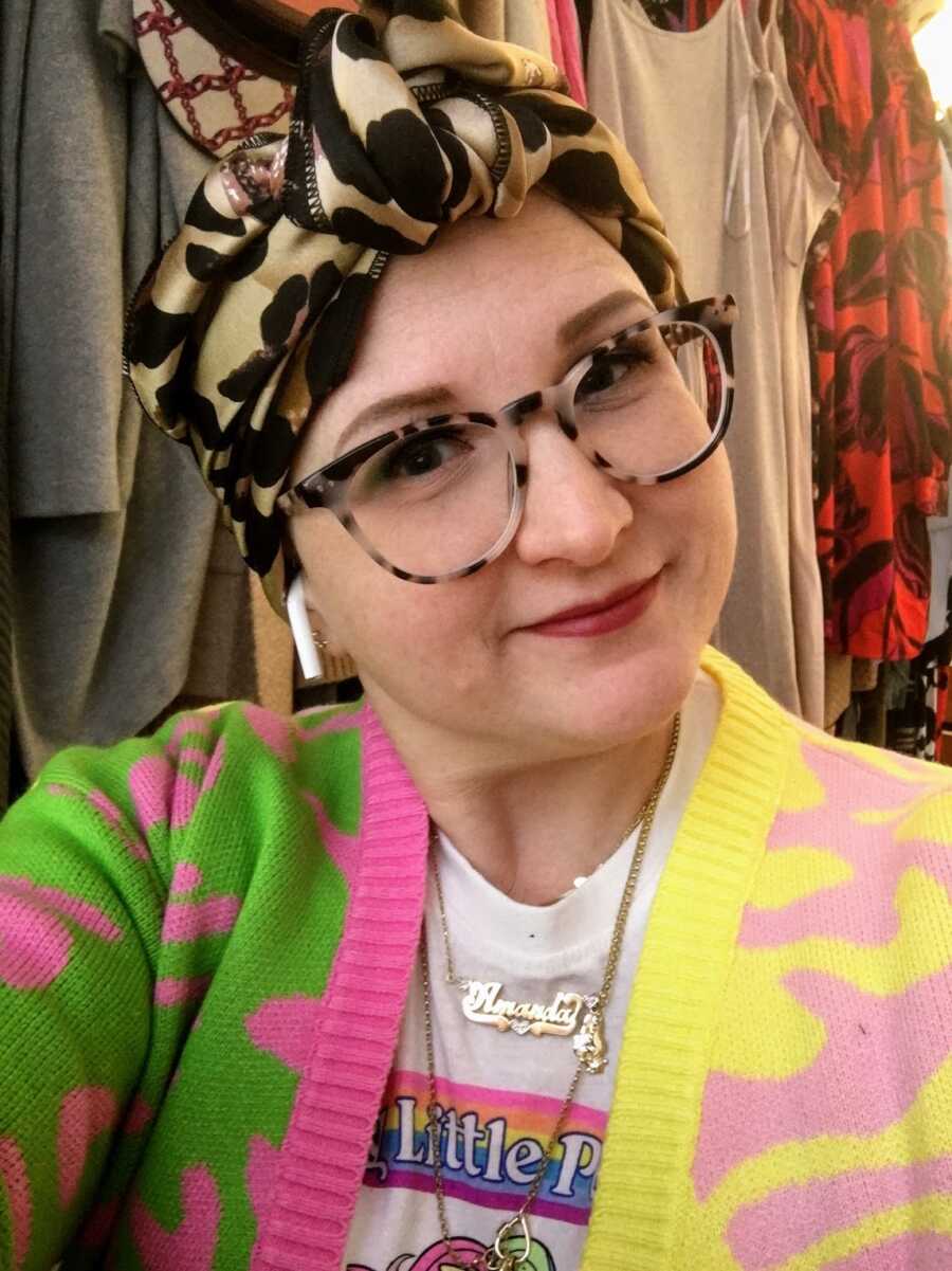 breast cancer patient in cute cardigan with a head wrap