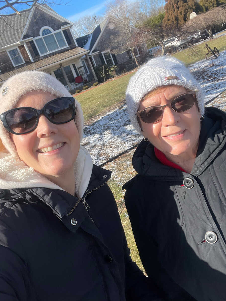 breast cancer survivor and her mother outside