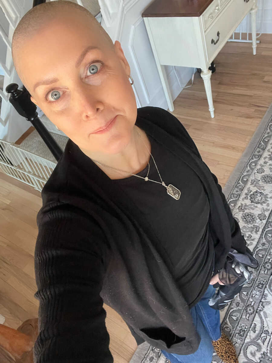 breast cancer survivor with shaved head