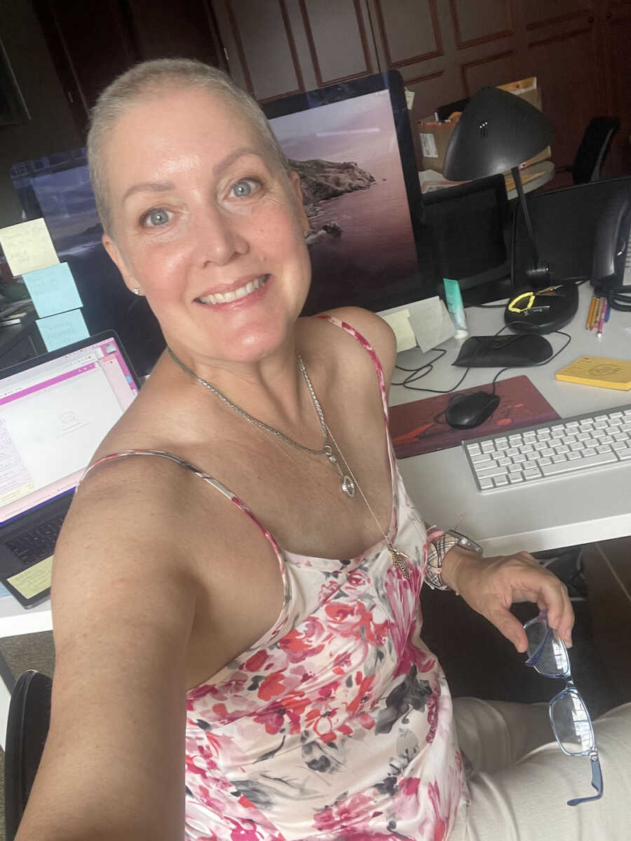 breast cancer warrior working at a desk