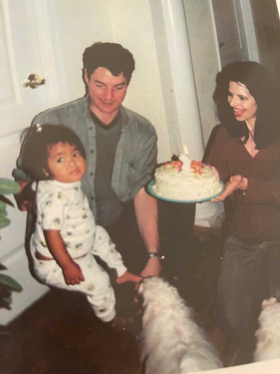 Myasthenia Gravis survivor as a baby celebrating first birthday with cake 