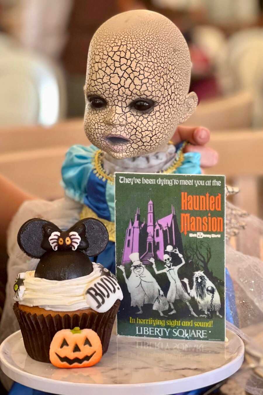 creepy halloween doll with cupcake and chocolate poster