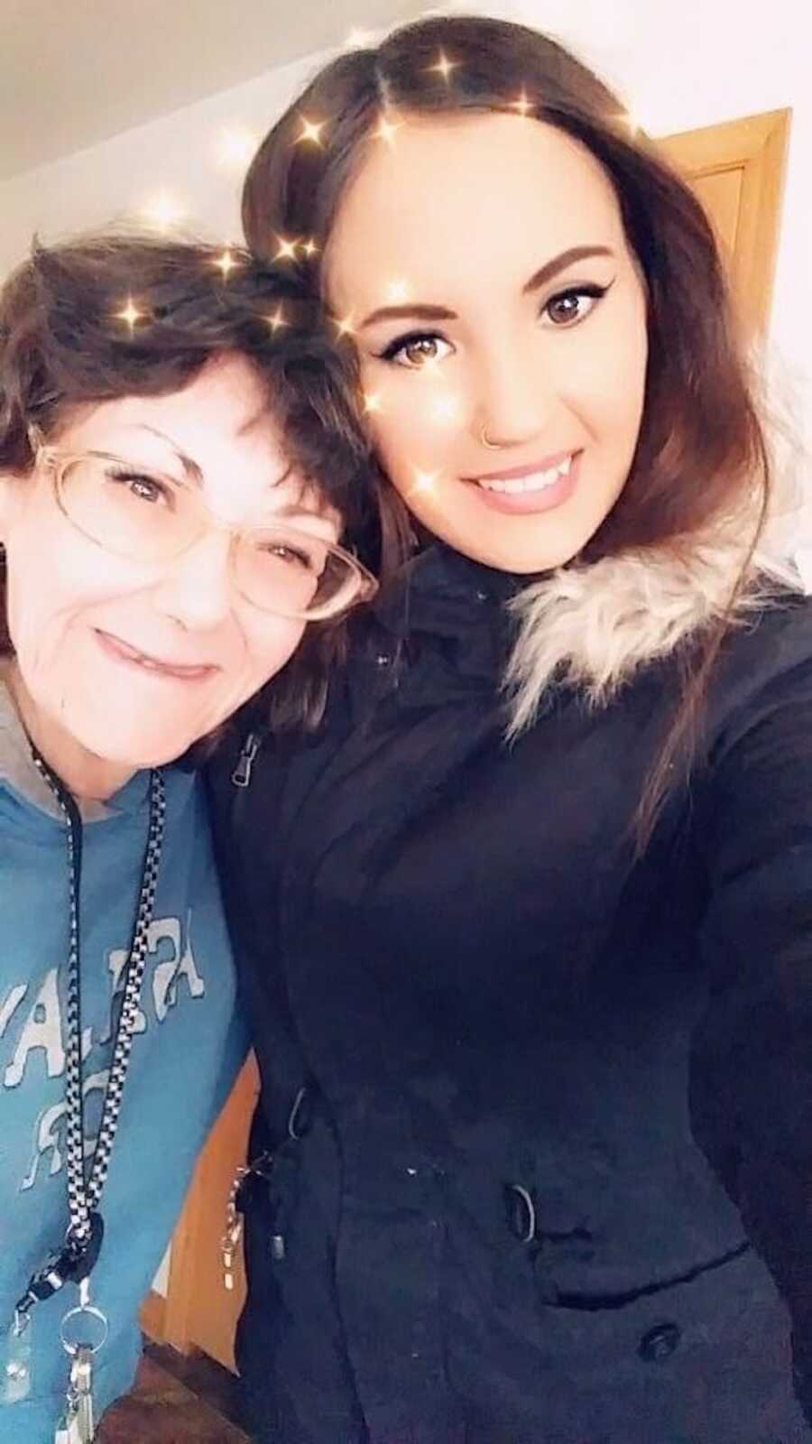 Mom and her caretaker daughter smile for a selfie