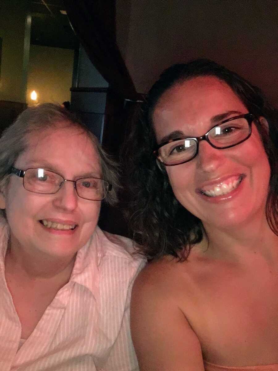 daughter smiling with Alzheimers diagnosed mother
