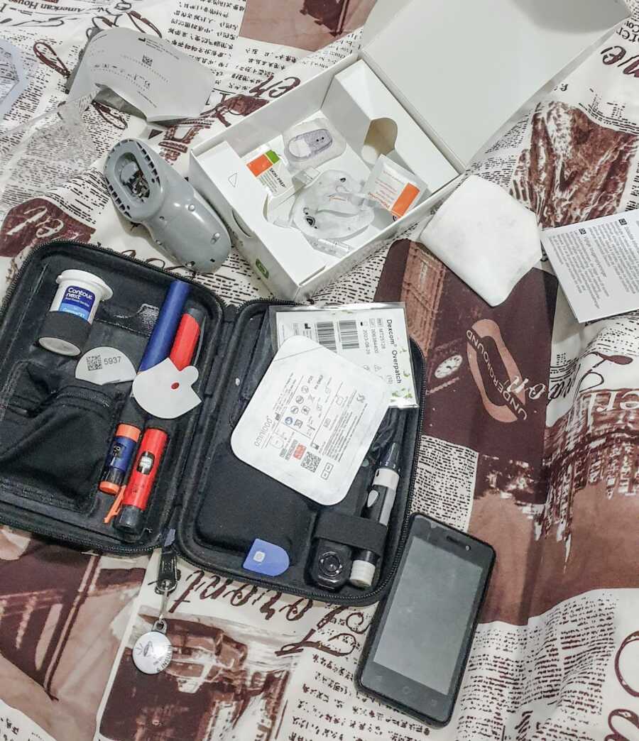 diabetic equipment laid out on blanket