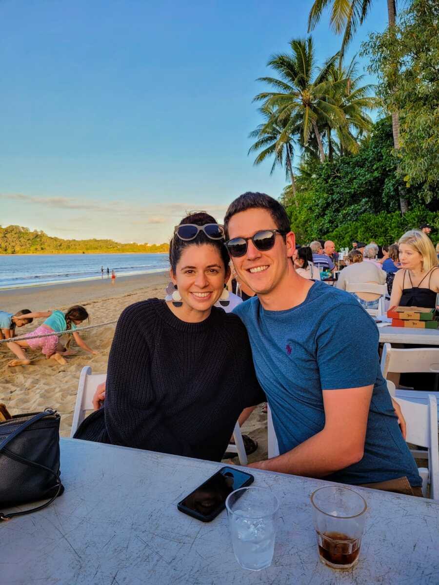diabetic woman with her boyfriend at a restaurant on the beach