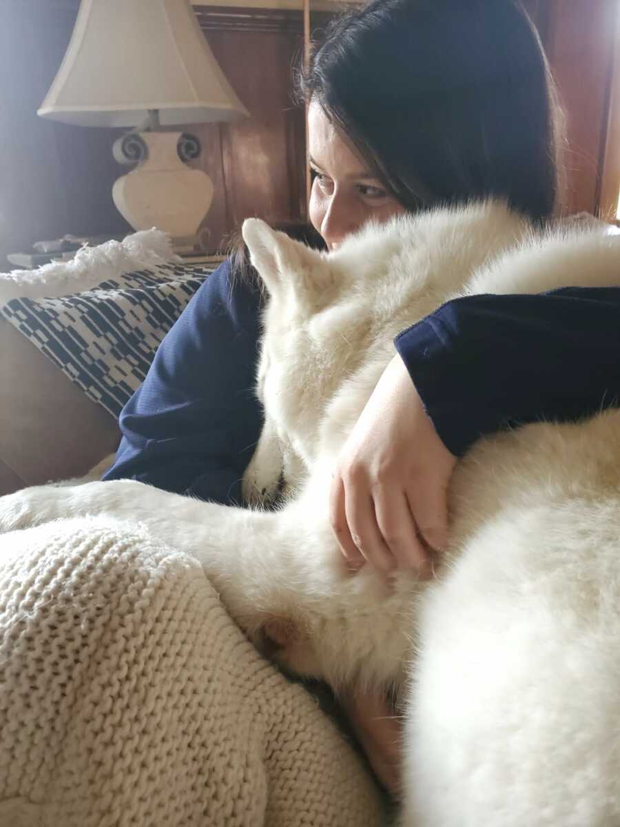 disabled chronically ill woman on couch with dog