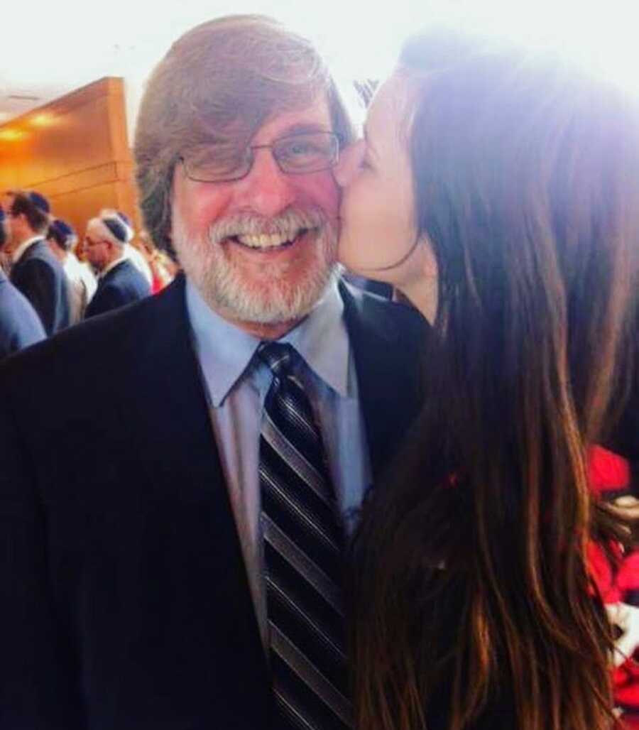 chronically ill girl with dad, gives him a kiss on cheek