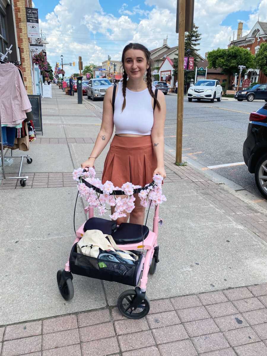 disabled woman with decorated walker in town