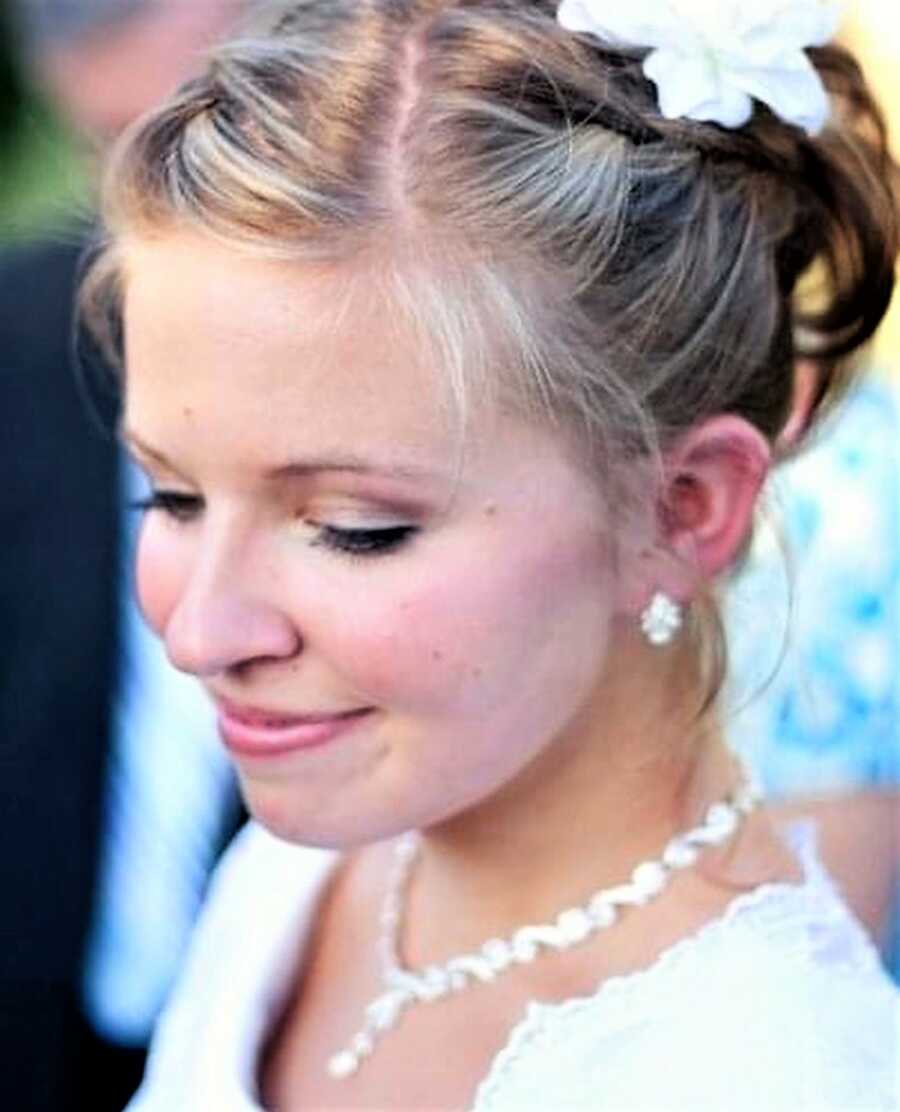 Face close-up of a bride looking down on her wedding day 