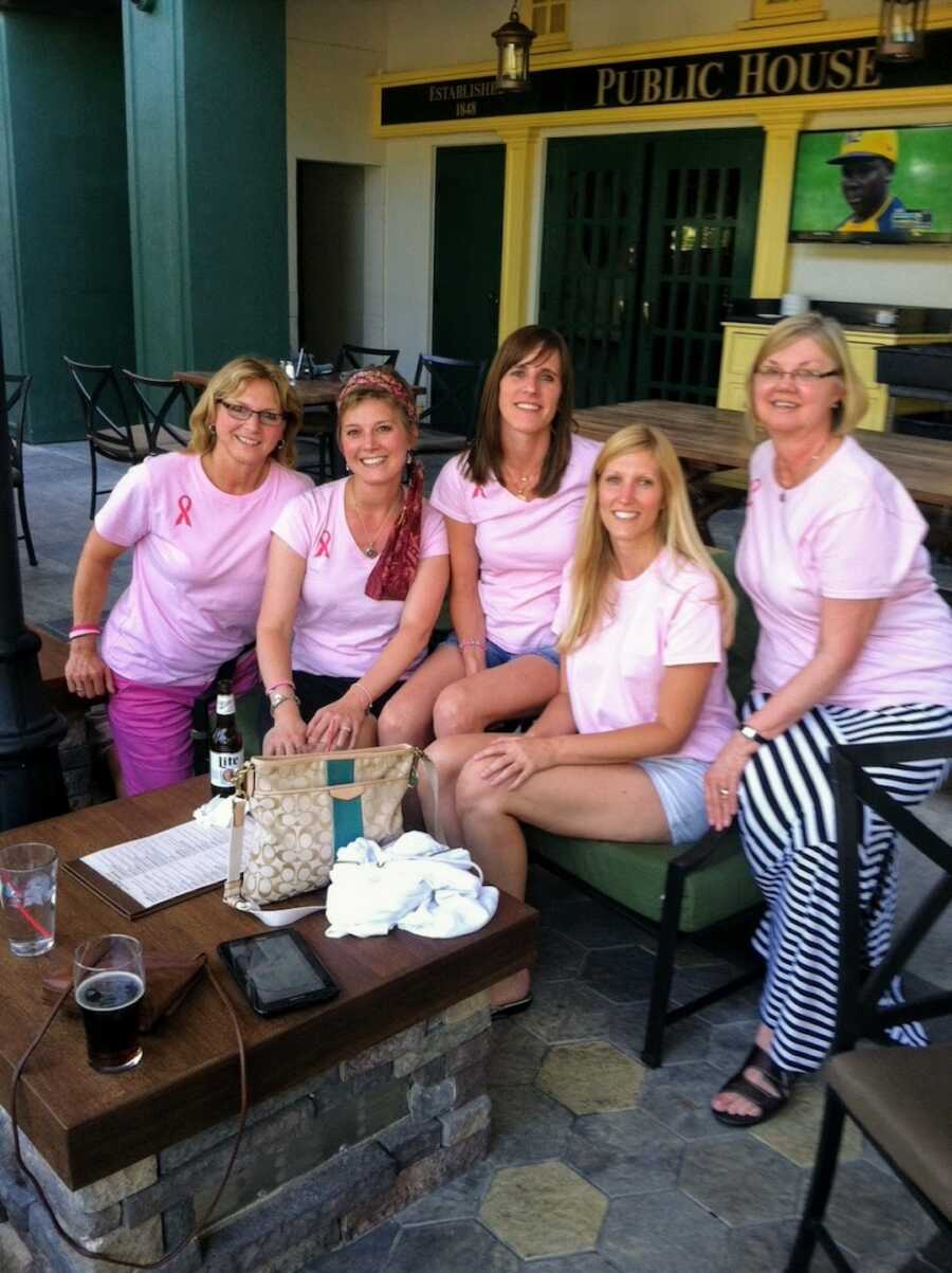 family wearing breast cancer shirts