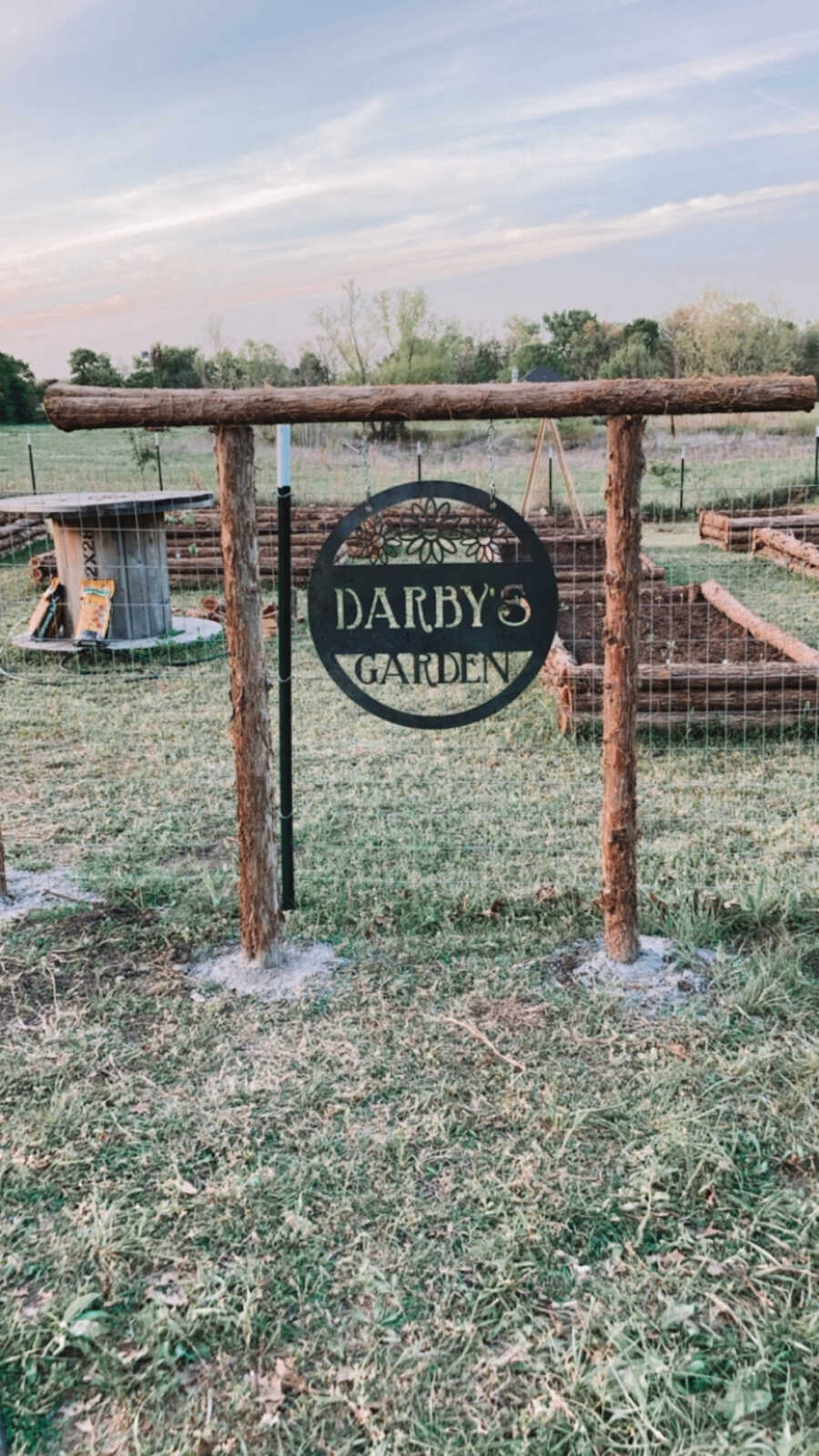 sign for garden honoring daughter who passed