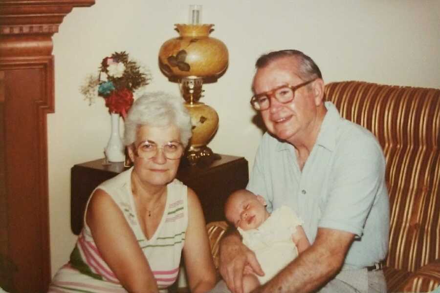 jehovah's witness grandparents holding baby grandchild