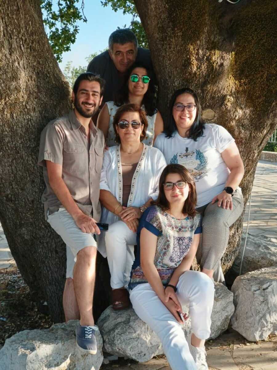 family photo leaned against tree