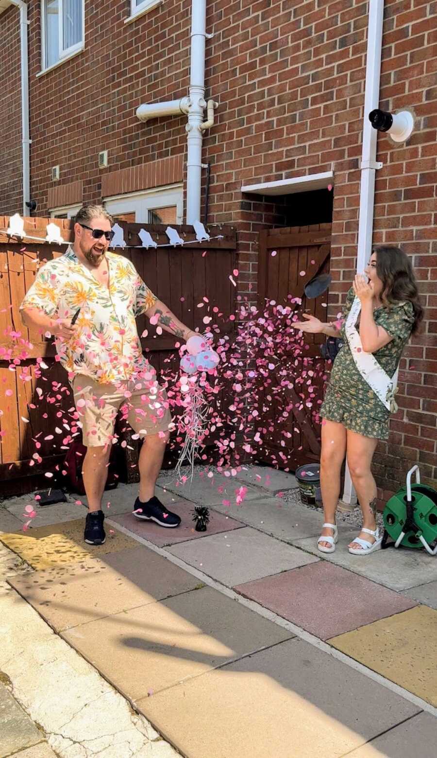 pregnant wife and her husband gender reveal of baby girl