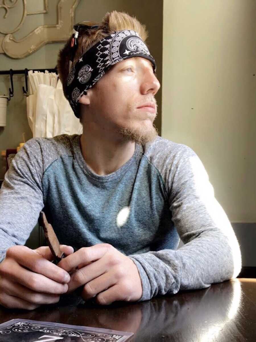 man with Cystic Fibrosis sitting at a table