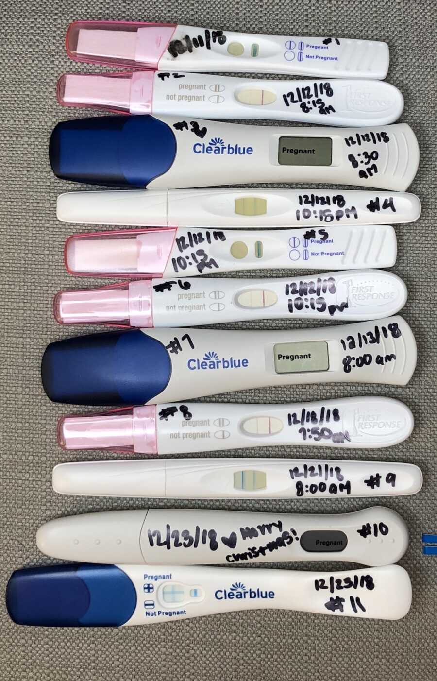 many positive pregnancy tests lined up together