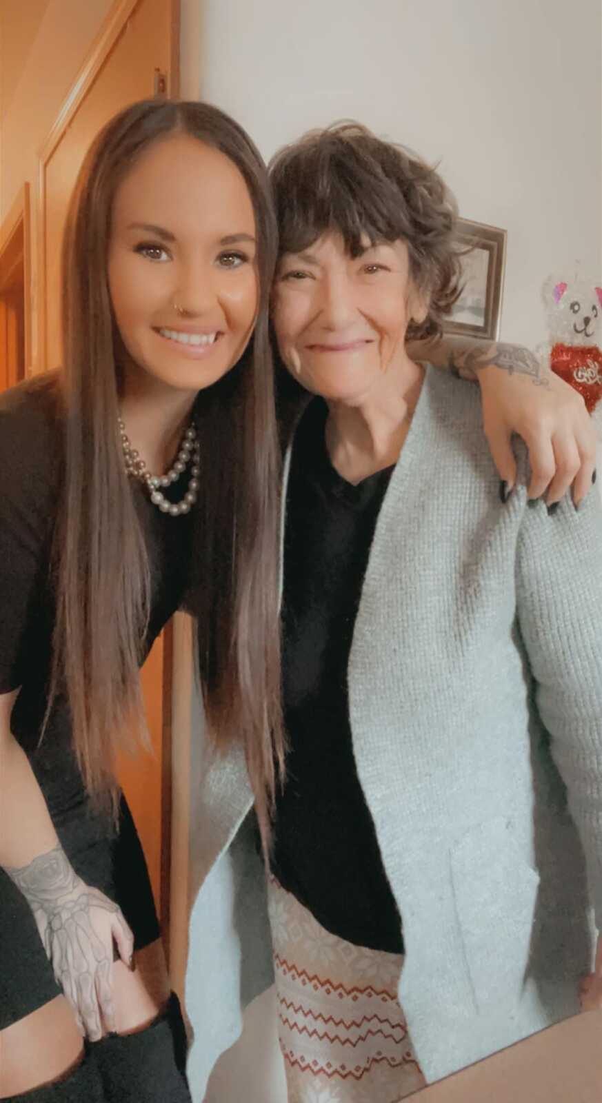 Daughter and mom with schizophrenia smile together