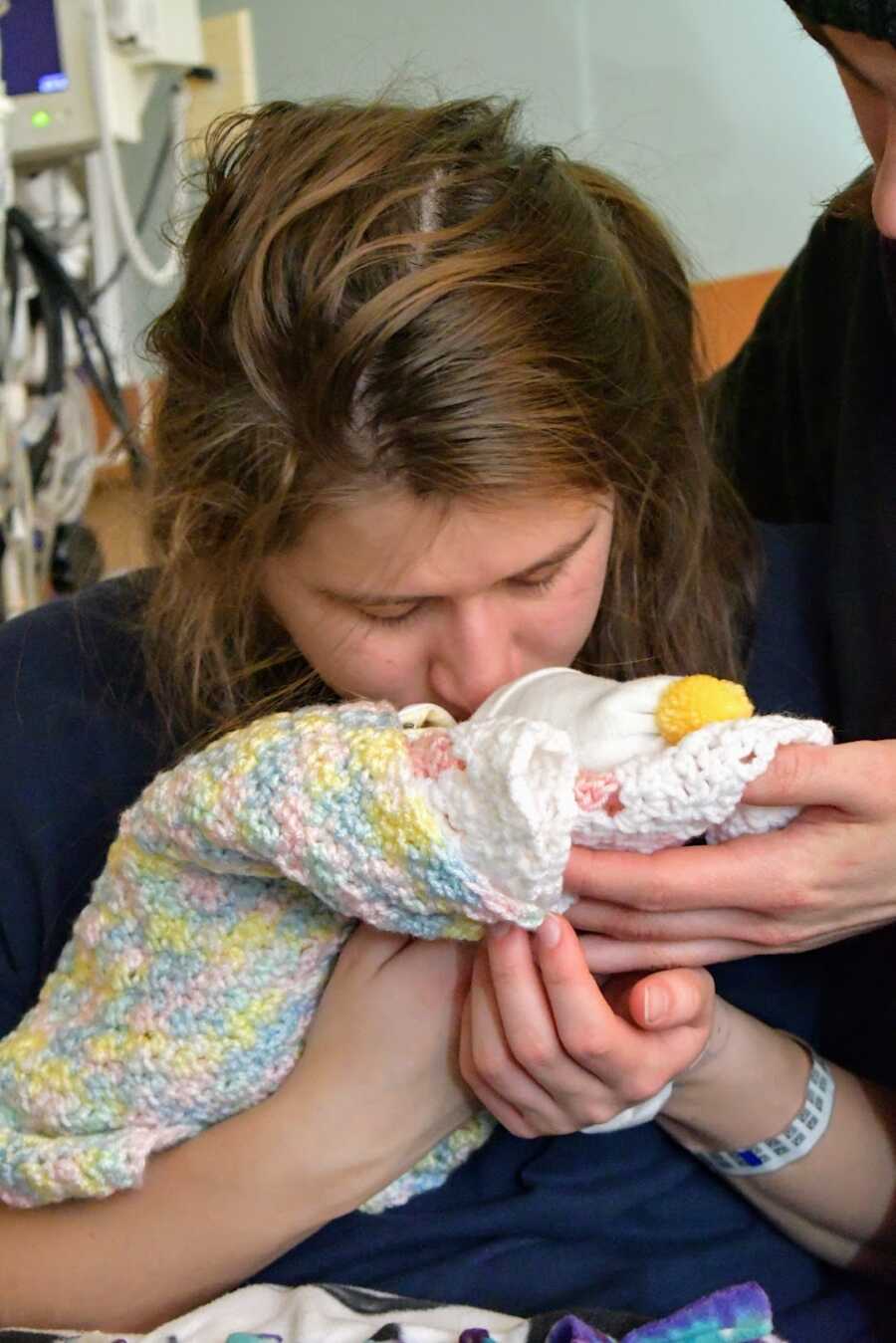 mother holding her stillborn daughter