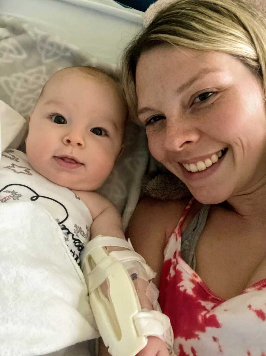 mother and infant son lying in a hospital bed