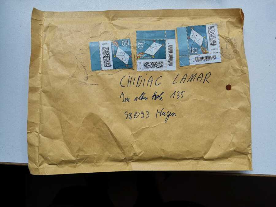 Enveloped package with address and stamps returning to owner