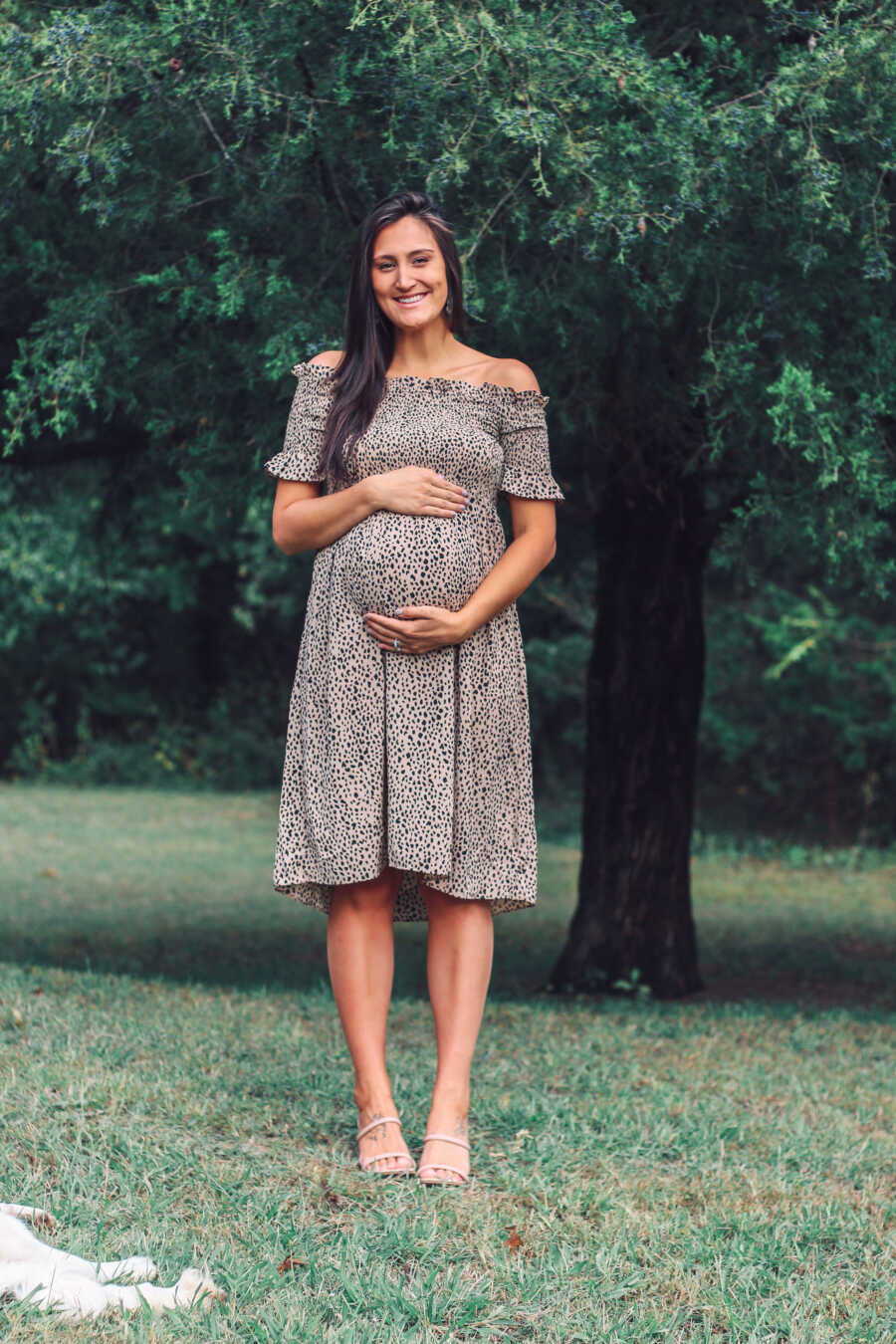 mom holding her baby bump