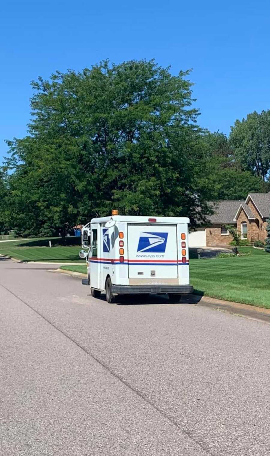 usps truck parked in residential neighborhood