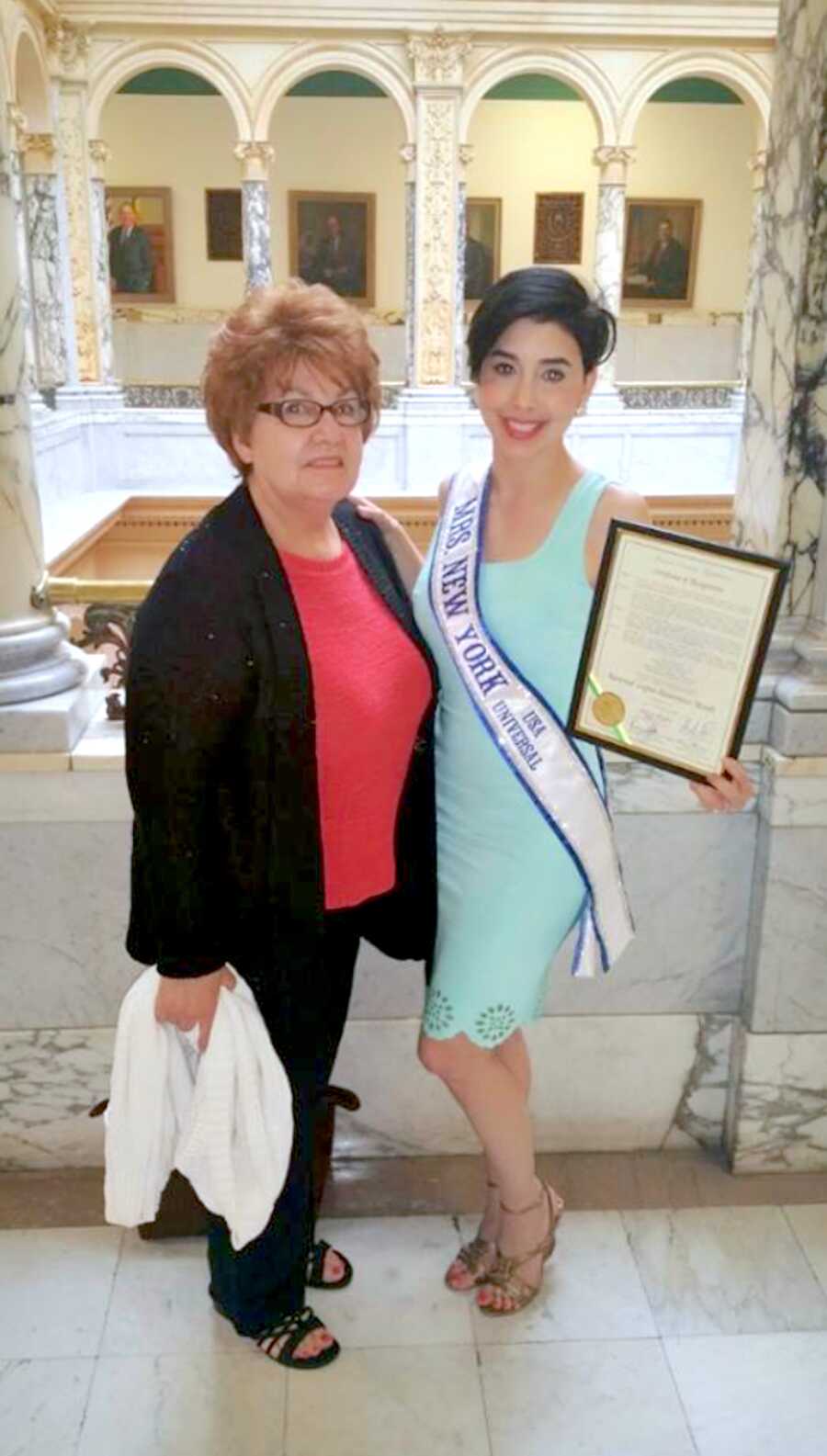 winner of Mrs. New York standing with her mom