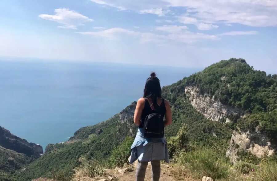 woman who is battling depression on hike overlooking view