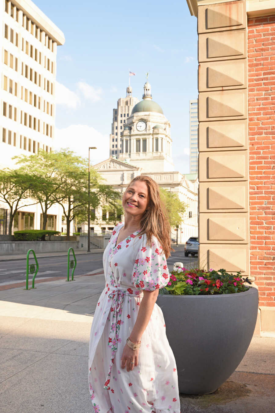 woman smiling in a city