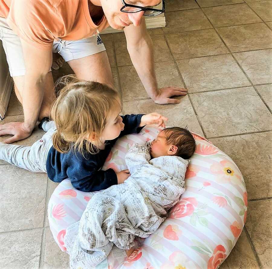 Dad of two bonding with newborn baby boy and first born daughter 