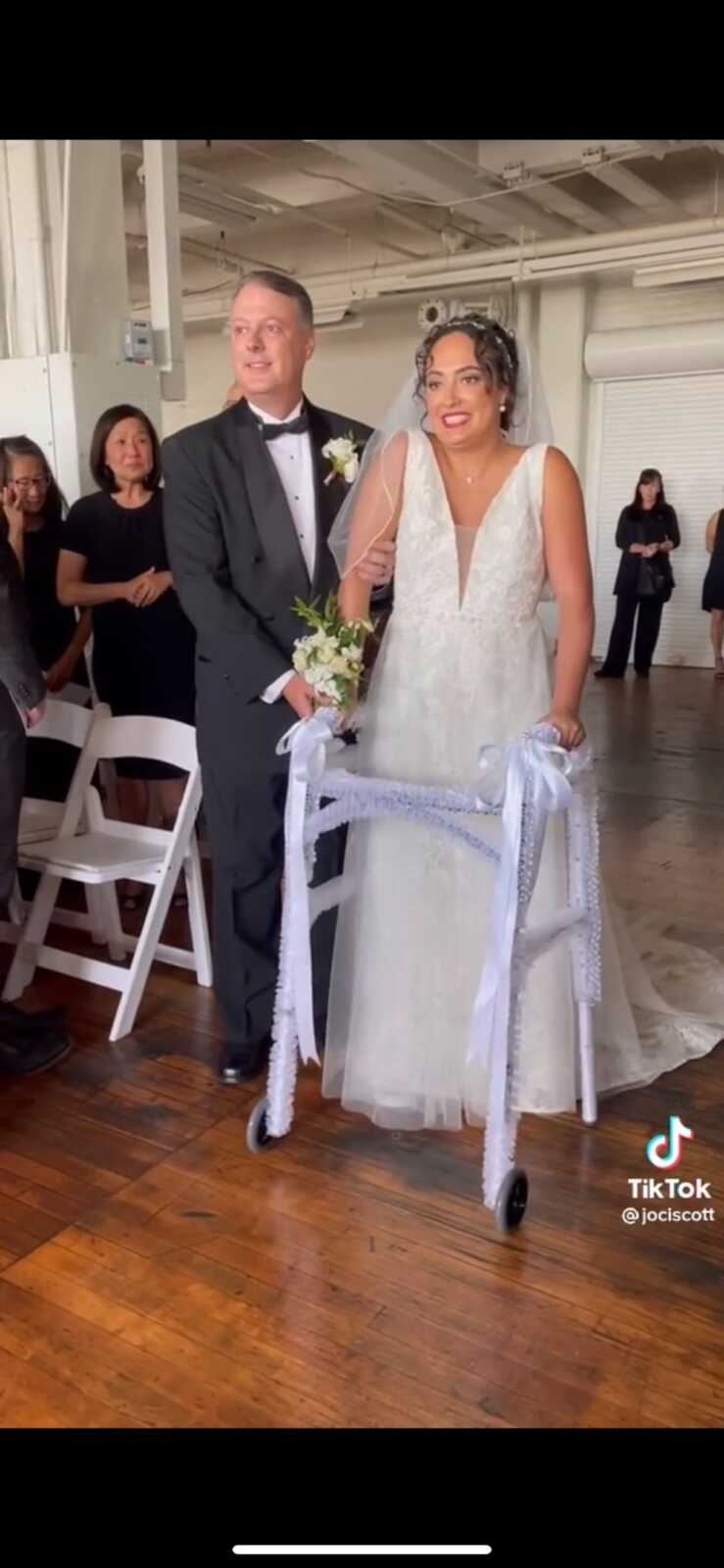 Paralyzed bride walks down aisle her dad