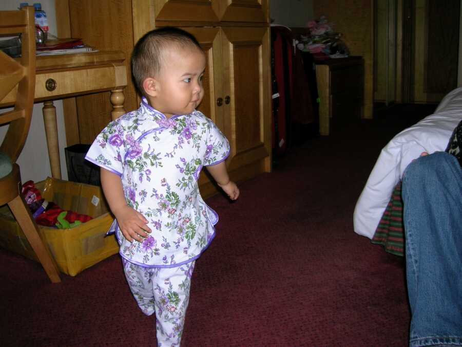 adopted daughter wearing traditional Chinese clothing
