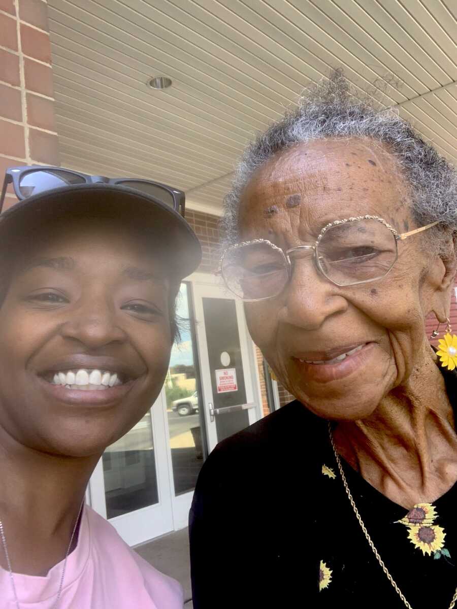 adoptee with her adoptive mother smiling