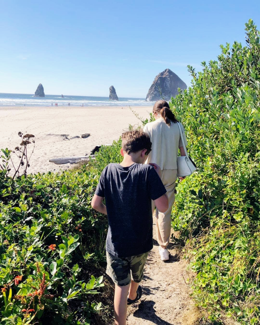 children hiking on trail near beach