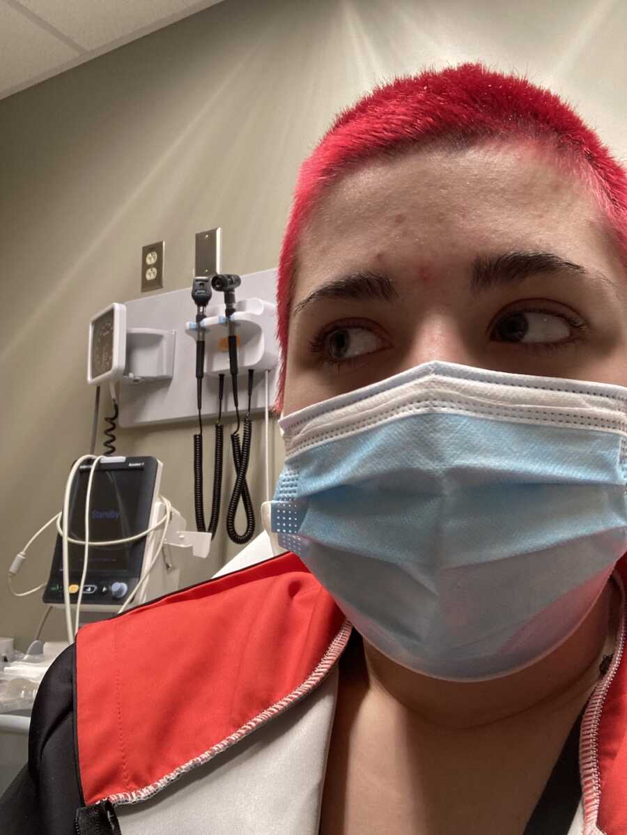 chronic illness warrior wearing surgical mask at the doctors