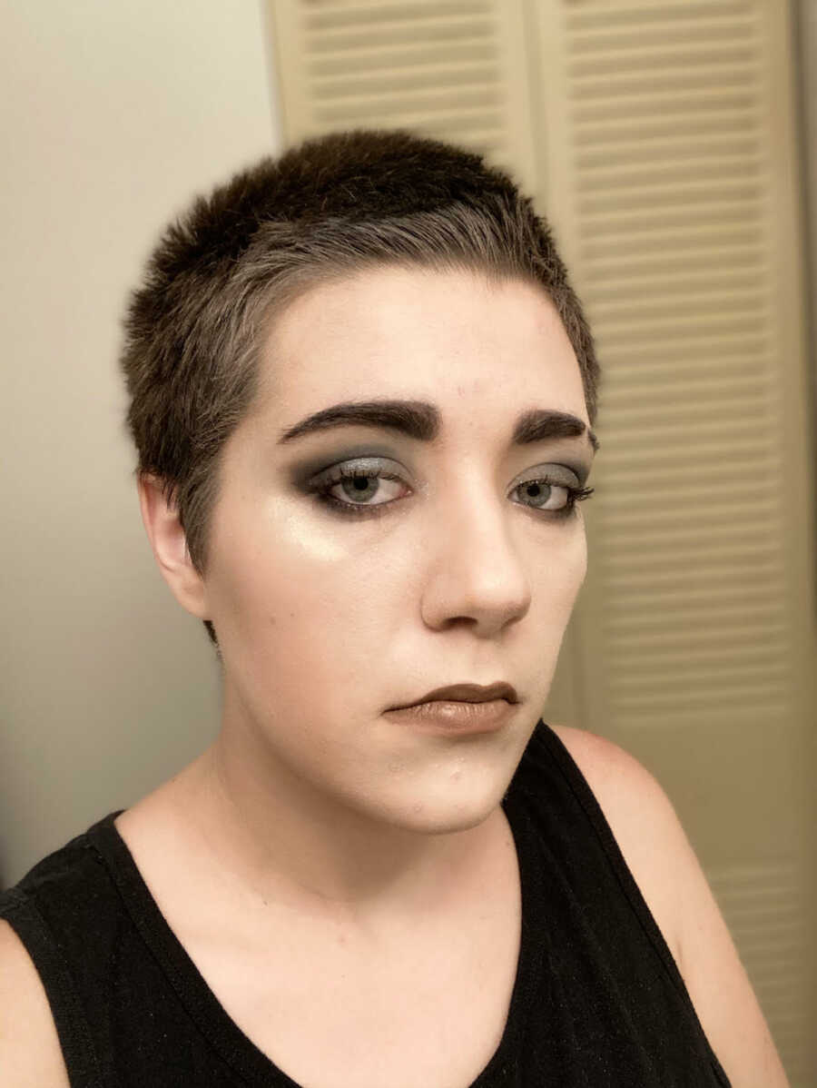 Chronic illness warrior wearing makeup taking a selfie