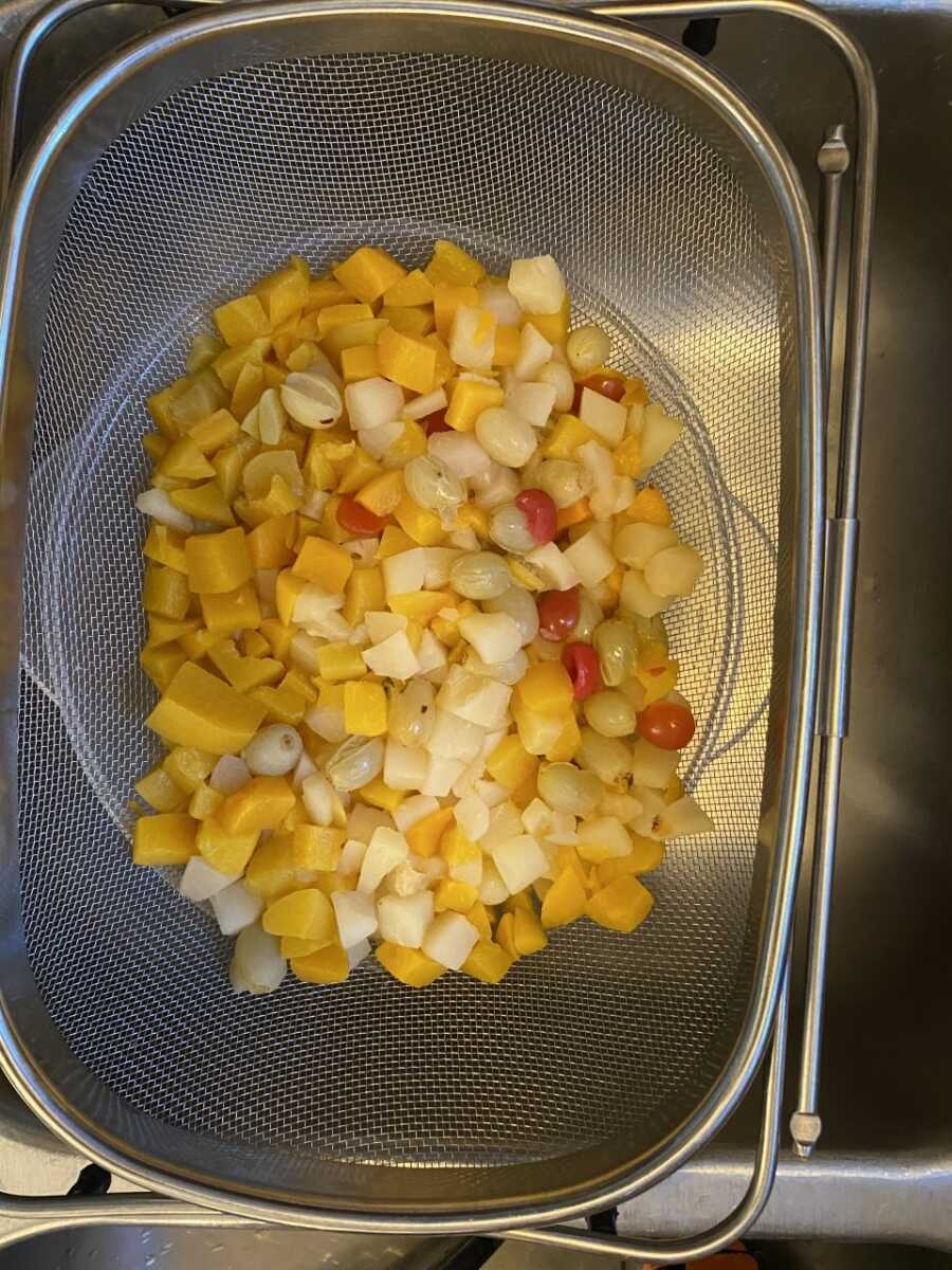 draining canned fruit cocktail mix