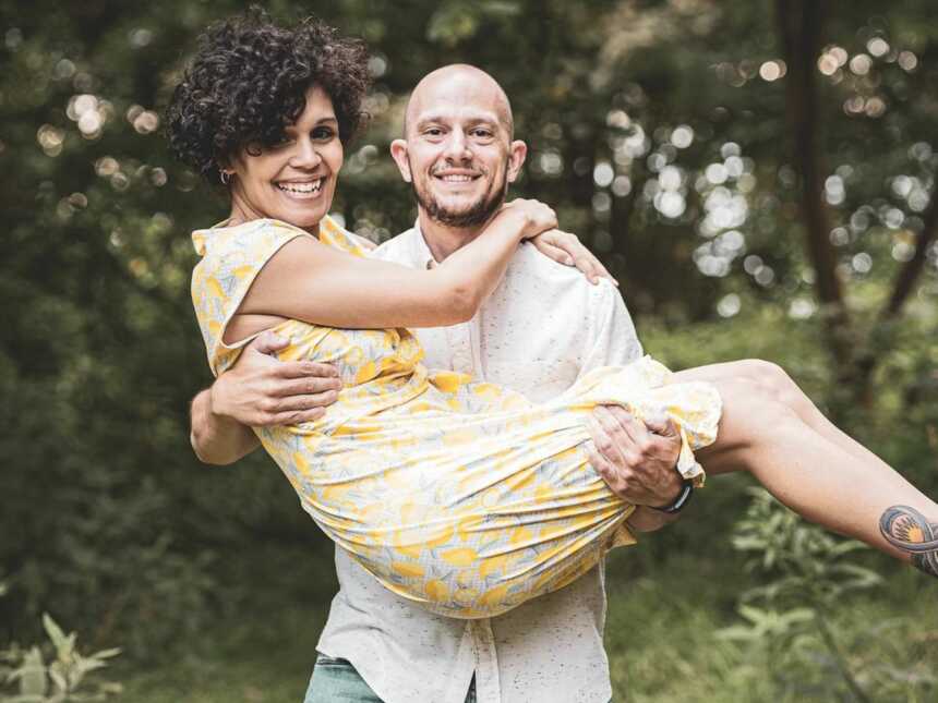 woman with epilepsy being carried by her supportive husband
