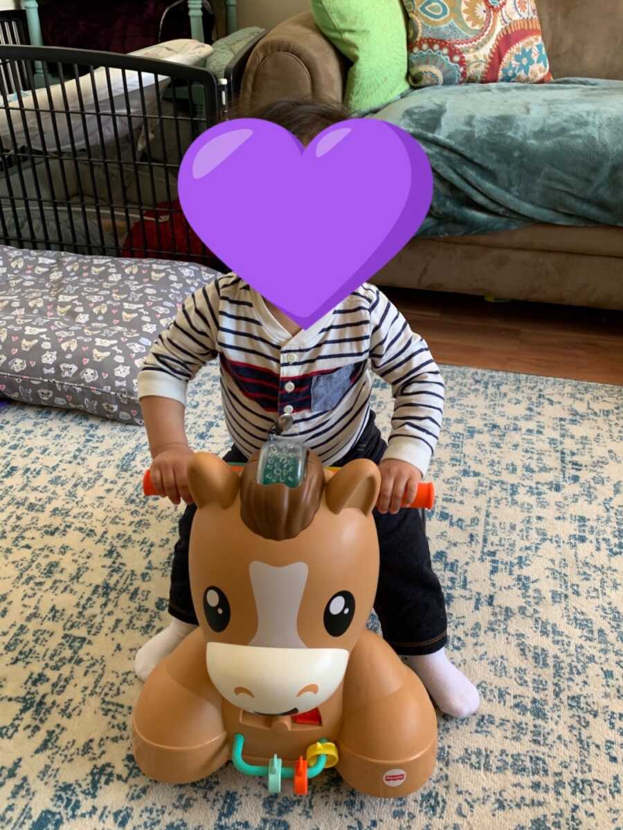 foster child plays on toy horse