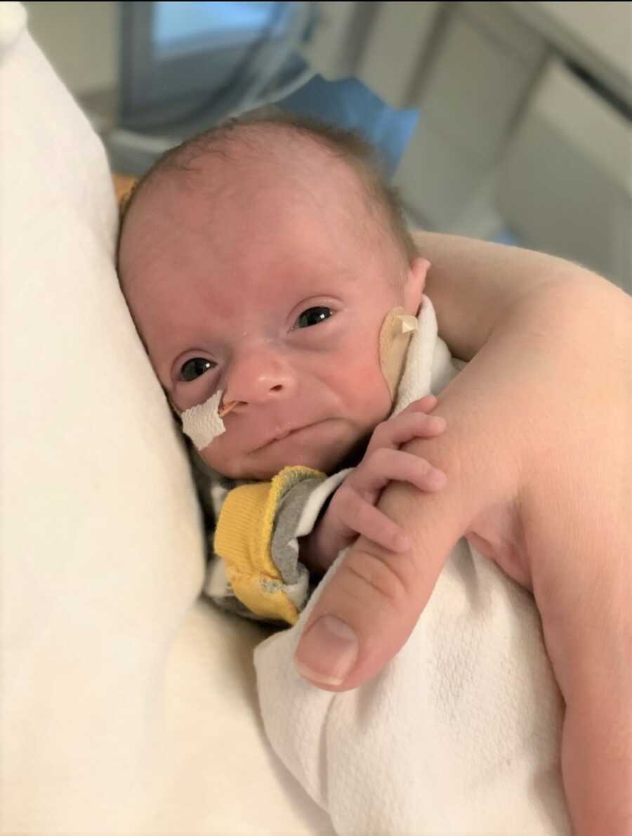 NICU preemie in foster mother's arms
