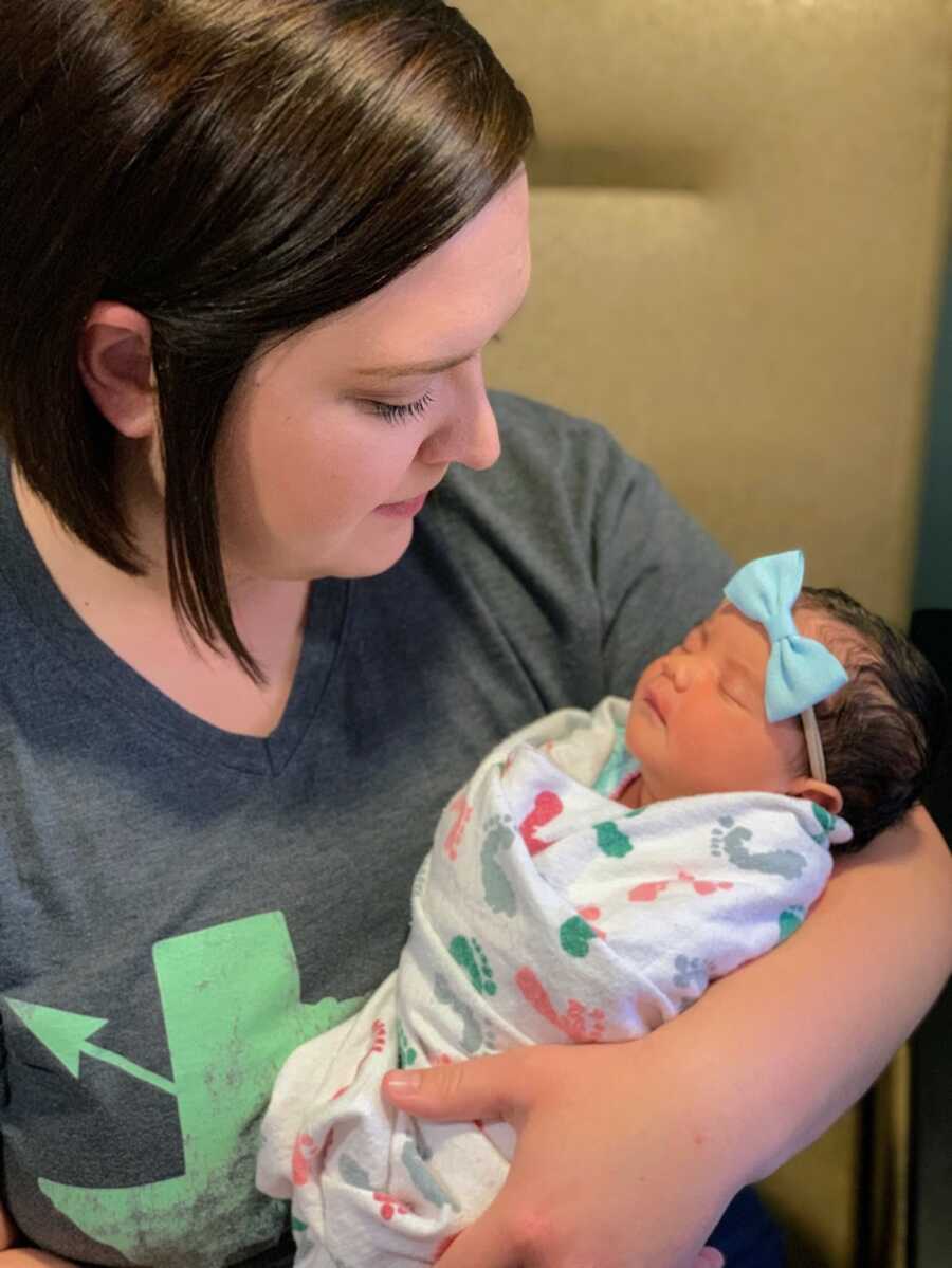 foster mother holding her newborn foster daughter